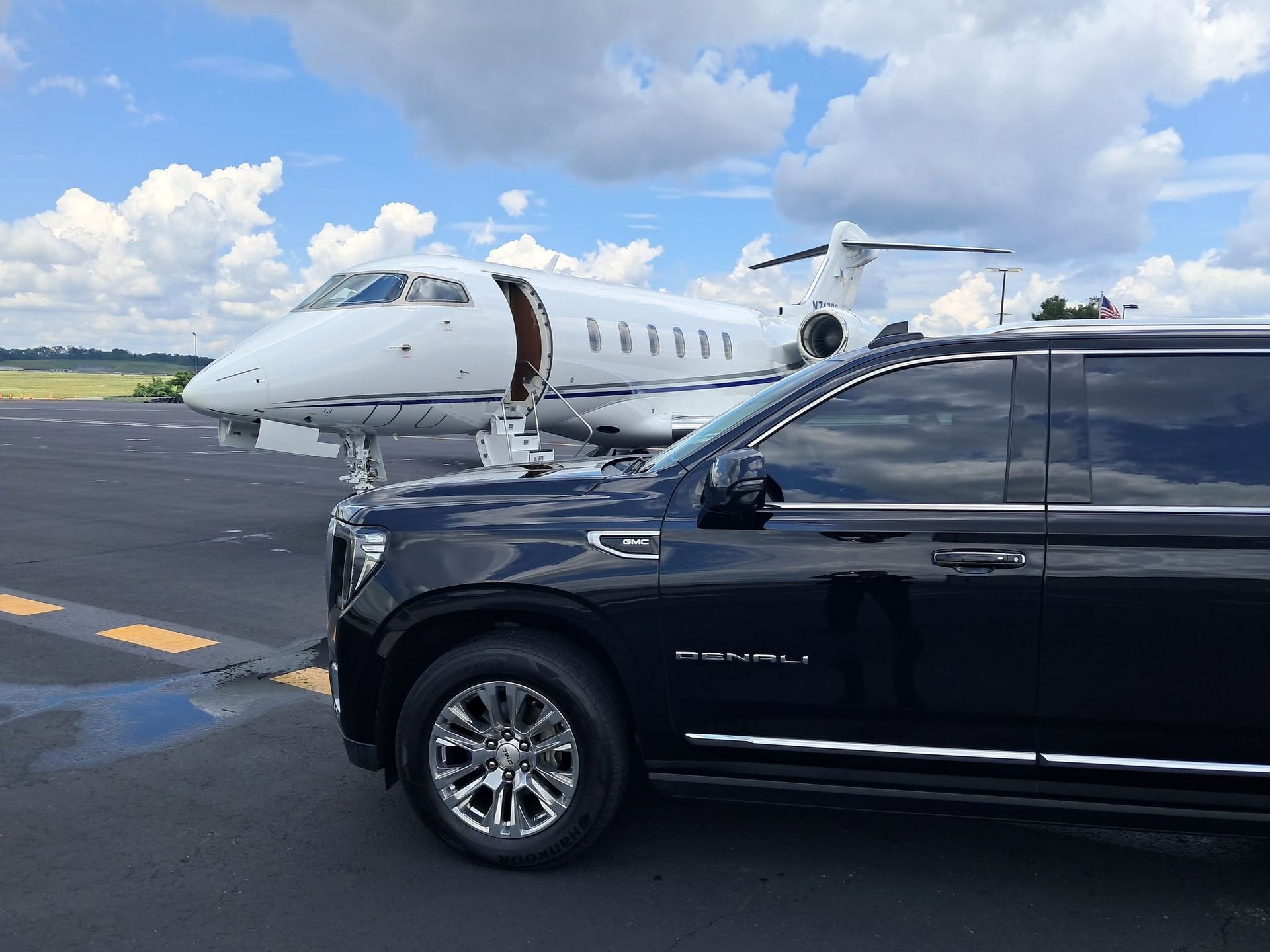 Luxury SUV beside a private jet