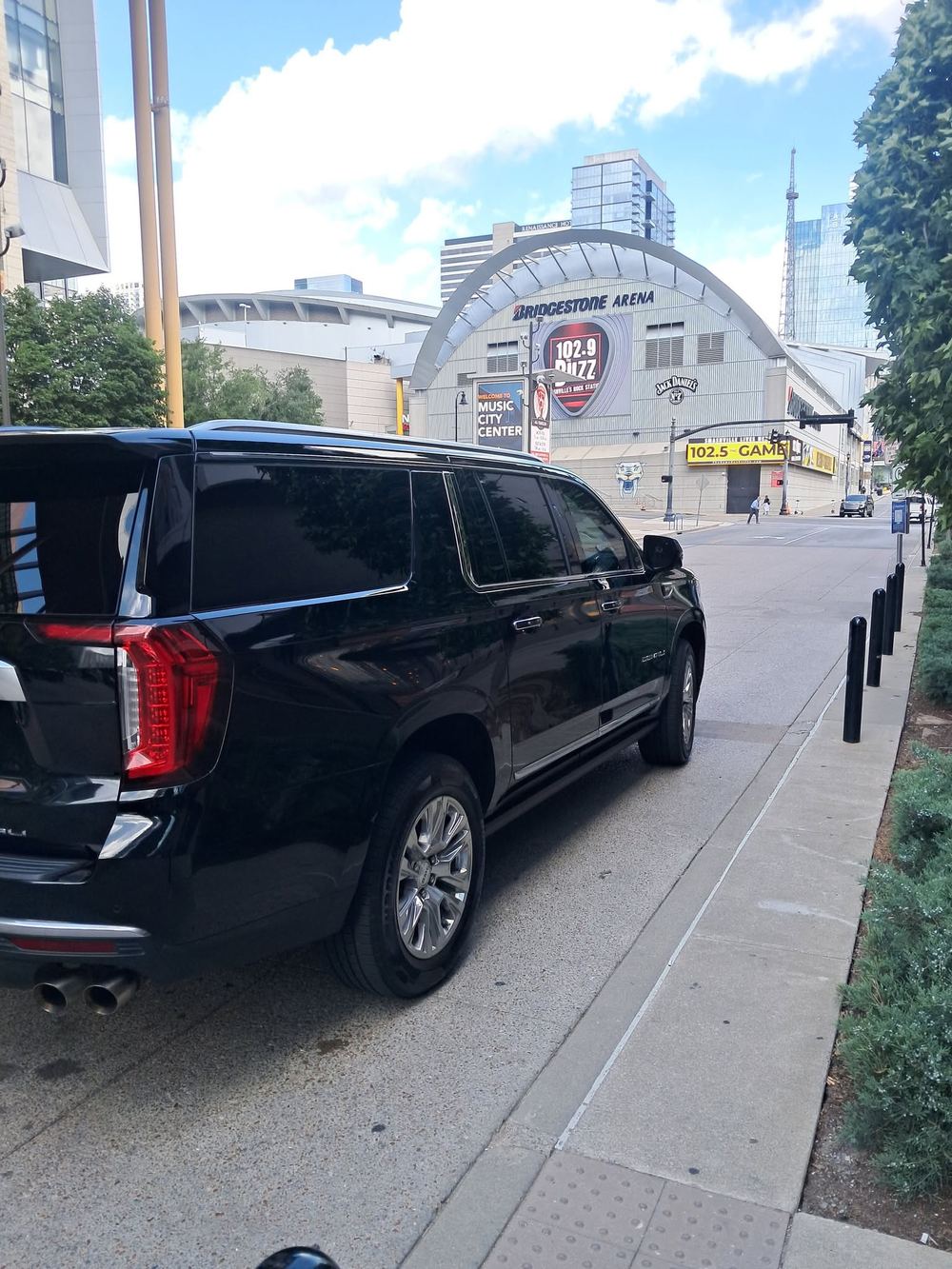 Black luxury SUV on a downtown Nashville street